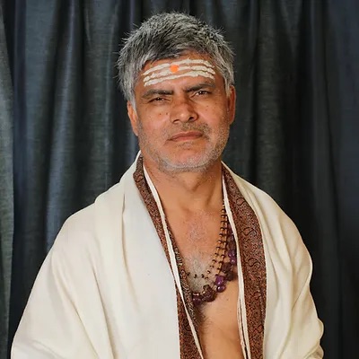 Portrait of Ācārya Dr. Sthaneshwar Timalsina, instructor of the Yogasūtra of Patañjali course